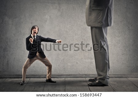 Japanese businessman attacks with karate moves a great man Royalty-Free Stock Photo #158693447
