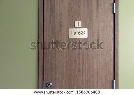 Signs on the door. Number one sign. Boss signboard. 