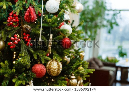 Christmas tree decorations on the branches background, tree decorated with retro toys