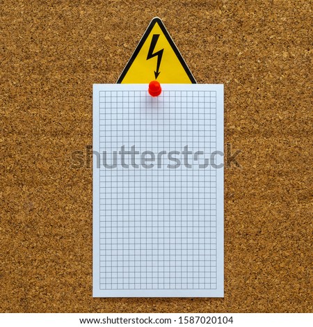 White blank paper sheet on the coark board, Danger Electrical Hazard High Voltage Sign.  Electrical Safety Announcement