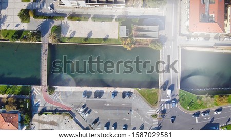 Aerial view of city promenade along the sea.