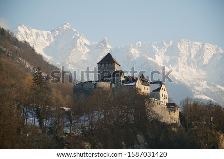 View of Liechtenstein Castle with snow capped mountains in the background, Vaduz, Liechenstein
