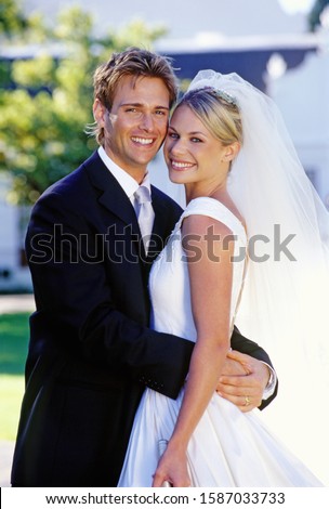 Portrait, bride and groom outdoors