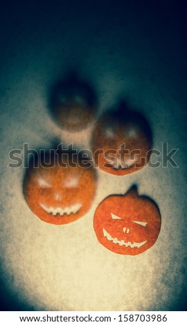 Illuminating Halloween pumpkin head silhouettes.