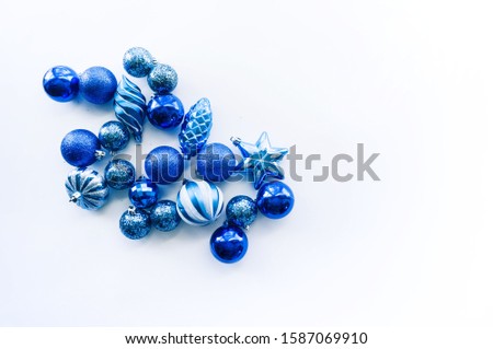 Trendy blue Christmas background. Ball toy Minimal monochrome concept. Copy space. Flat lay style. Open composition. Color of the year 2020.