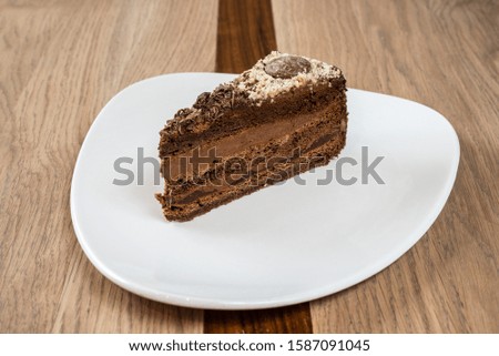 Creamy cake served on a white plate