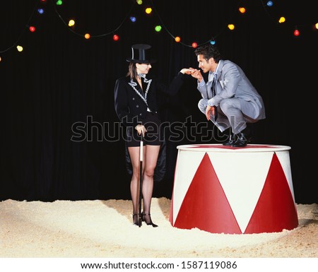 male animal tamer dominating a businessman