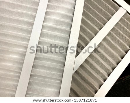 Clean and dirty HVAC air filters Royalty-Free Stock Photo #1587121891