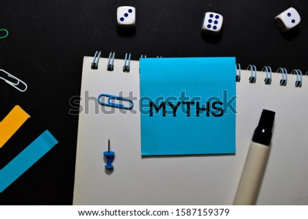 MYTHS text on sticky notes isolated on office desk