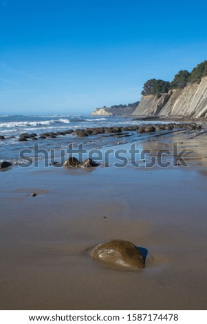 Massive rock outcropping at Bowling ball beach california