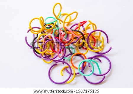 Colorful variety of plastic wire, stapler That after use and bring together