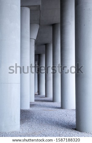 Gray pattern of concrete column under high way showing the abstract style from architecture.