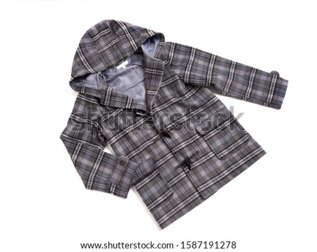 A trench coat for children taken with a white background.