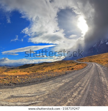 National Park Torres del Paine in Chile. Awesome cloud over a gravel road. The picture was taken Fisheye lens