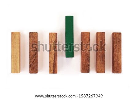 Abstract wooden block on white background. Symbol of leadership, teamwork and different. Business and design concept.
