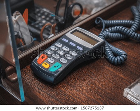 Payment terminal on wood table