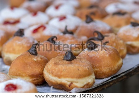 Hanukkah donuts (sufgania) are delicious and sweet in honor of Chanukah (the winter Jewish holiday in memory of miracles and wonders). Filled with strawberry jam or milk jam and deep-fried.