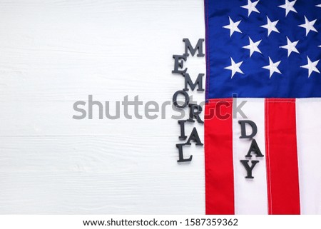 USA flag and text MEMORIAL DAY on white wooden background