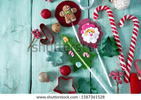 Christmas candies on turquoise surface