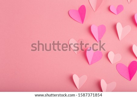 background with pink hearts made of paper, free space for text
