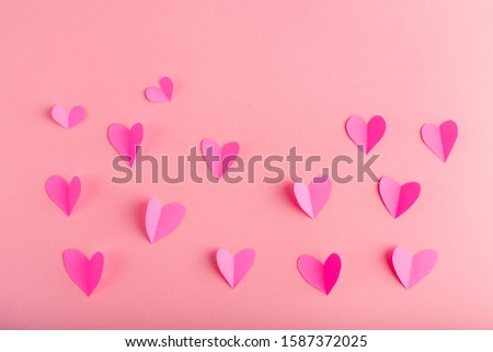 background with pink hearts made of paper, handmade