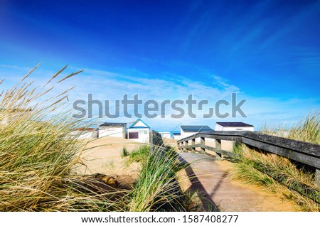 pretty landscape with beach cabins on the coast in northern France