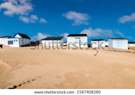 pretty landscape with beach cabins on the coast in northern France