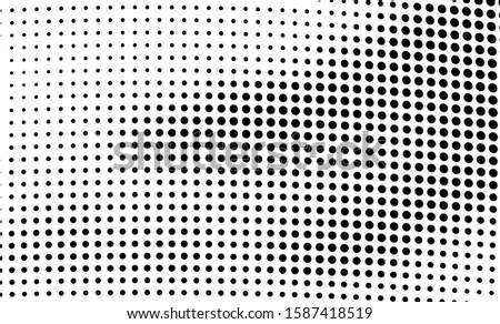 Abstract halftone wave dotted background. Chaotic dance of black dots on white background