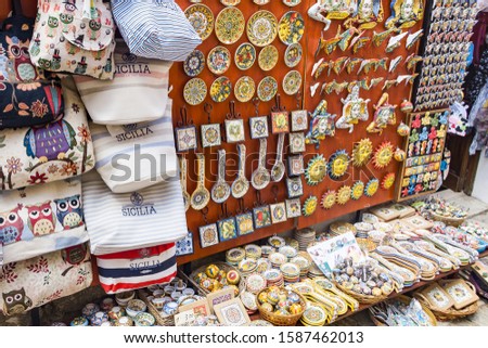 Sicily. Eris. Souvenirs are different-small colorful vases, jugs, plates with fish. 