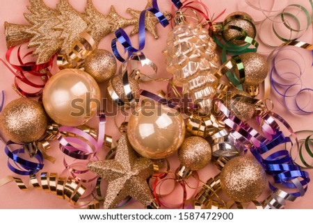 Beautiful festive purple background with sparkles and Christmas golden toys. Holiday Content. New year 2020