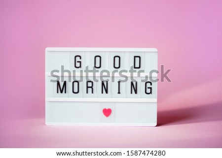 Lightbox with the words good morning on a pink background. Flat lay Top view Concept of rest, relax, time to sleep