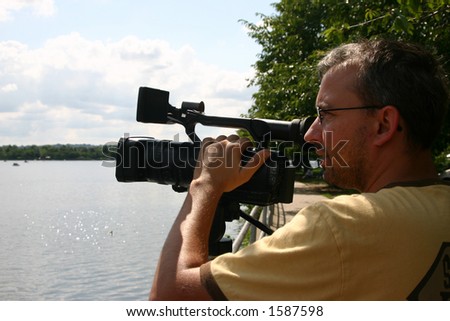 Cameraman shooting video Royalty-Free Stock Photo #1587598