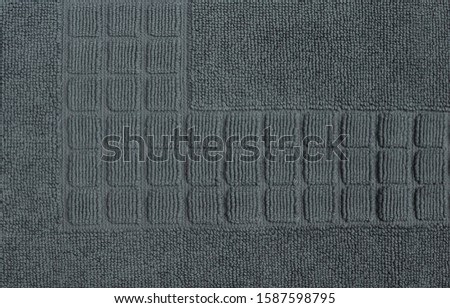 close-up dark gray foot mat
