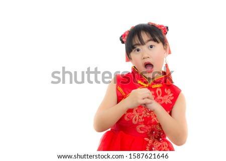 A picture of an Asian girl wearing a red Chinese dress in a white background. Concept Chinese new year for the love day and is a tradition in China every year.
