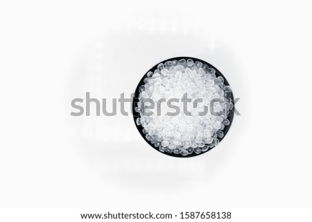 Polypropylene granule close-up background texture. Royalty-Free Stock Photo #1587658138