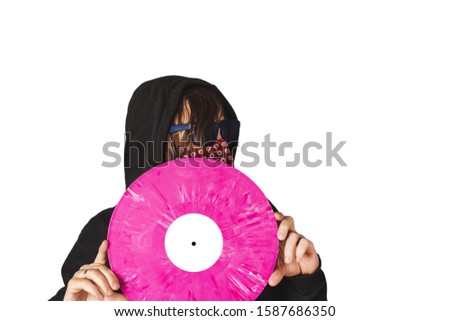 A man holds a pink vinyl record. Isolate on a white background. Music piracy and plagiarism. Stealing the music.