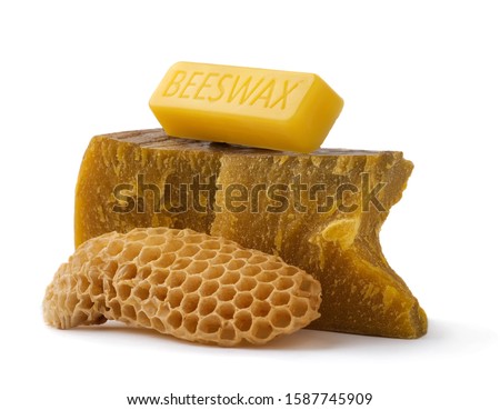 How to get natural organic beeswax. Pieces of organic beeswax on a white background. The use of beeswax in apitherapy. Production Ingredient for Medical and Cosmetics. Royalty-Free Stock Photo #1587745909