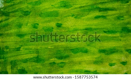 Photo of a bright colorful watercolor background. Gouache drawing. White, green texture.