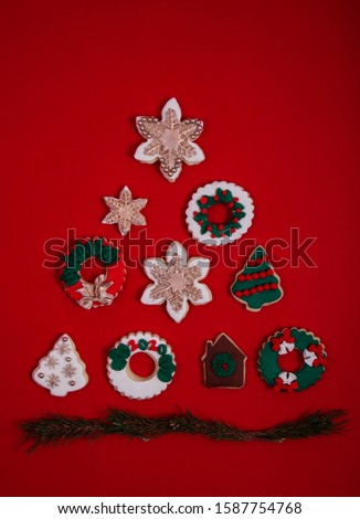 Delicious and special Christmas cookies are arranged near to each other to make a Christmas tree symbol.