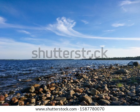 Sweden rocky sea side. Northern epic bright blue sky and nice clouds sunny landscape. Travel scandinavia