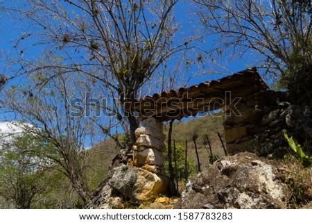 Horizontal photo showing a detail of a rustic rural stone wall.