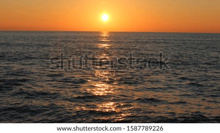 Seaside background image at sunset while shades of sunset color