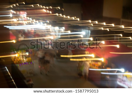 Abstract long exposure of a night market in Thailand
