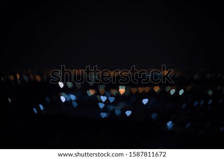 Heart shaped bokeh City night lights with a black background