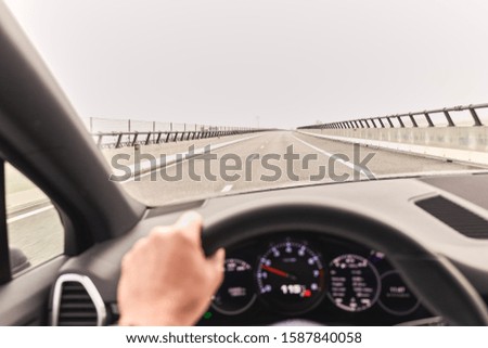 Driving car on empty road, generic photo