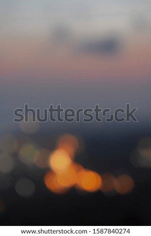 Abstract obscures the city light night bokeh at sunset over the peak of Parangtritis, Yogyakarta