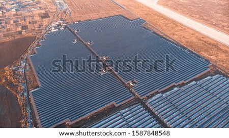 Aerial view of a larger number of solar panels, aerial photography.