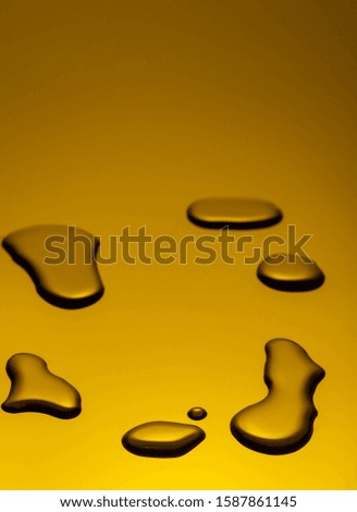 Drops on a yellow gradient closeup vertical.