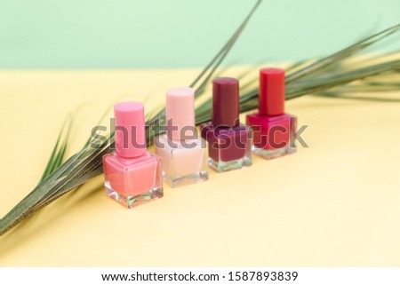 Nail polishes on a green background