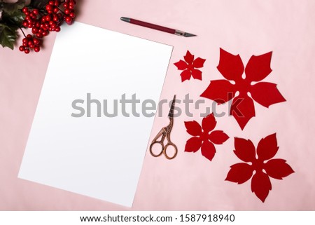 Homemade Christmas decorations and a white blank page